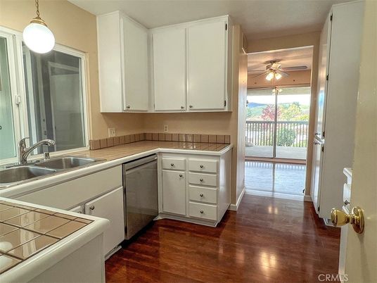 Interior, Kitchen, Pendant Lights, Tile Countertops, Wood Texture Flooring