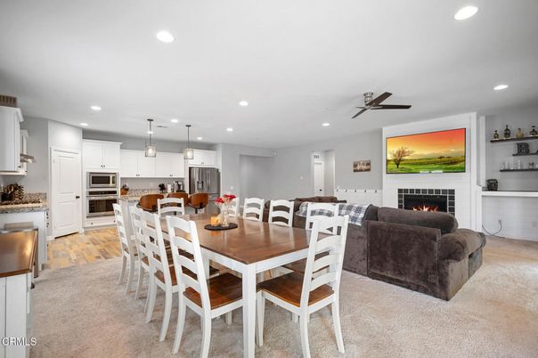 Dining room, Fireplace, Interior, Kitchen, Living room, Pendant Lights, Recessed Lighting, Stainless Steel Appliances, Wood Texture Flooring