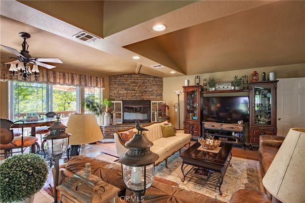 Fireplace, Interior, Living room, Recessed Lighting, Stone Walls, Wood Texture Flooring