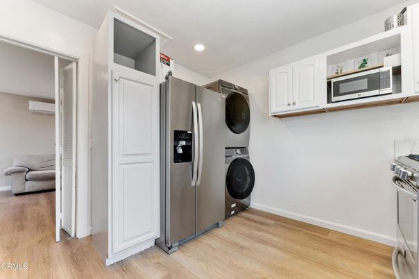 Interior, Kitchen, Recessed Lighting, Stainless Steel Appliances, Washer, Wood Texture Flooring