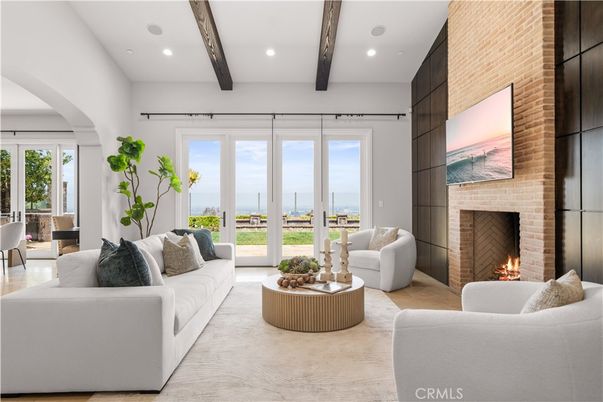 Fireplace, Interior, Living room, Recessed Lighting, Stone Walls, Water, Wooden Beams