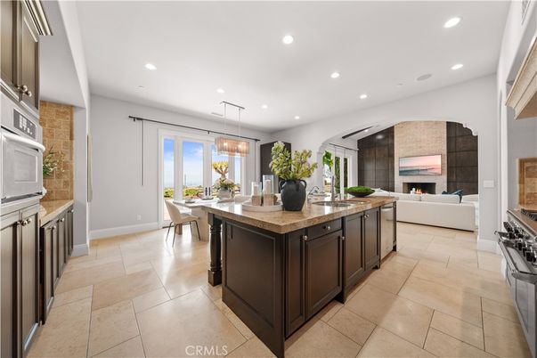 Dining room, Fireplace, Interior, Kitchen, Living room, Pendant Lights, Recessed Lighting, Stainless Steel Appliances, Stone Walls