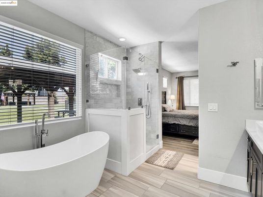 Bathroom, Bedroom, Free Standing Baths, Glass Shower, Interior, Marble Walls, Recessed Lighting, Wood Texture Flooring