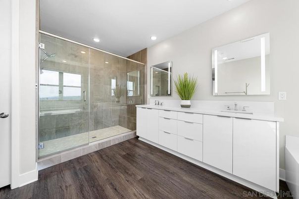 Bathroom, Dual Sink Vanities, Glass Shower, Interior, Recessed Lighting, Wood Texture Flooring