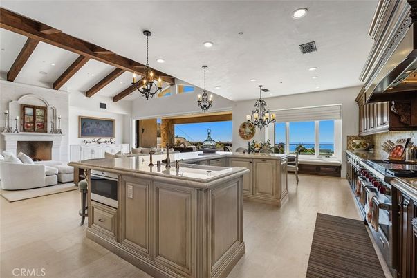 Chandelier, Fireplace, Interior, Kitchen, Living room, Recessed Lighting, Water, Wooden Beams