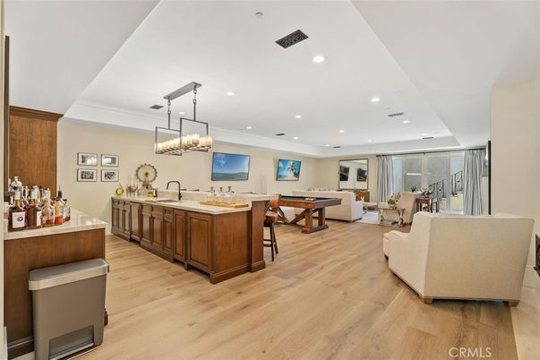 Billiard Table, Chandelier, Dining room, Game Room, Interior, Living room, Pendant Lights, Recessed Lighting, Wood Texture Flooring