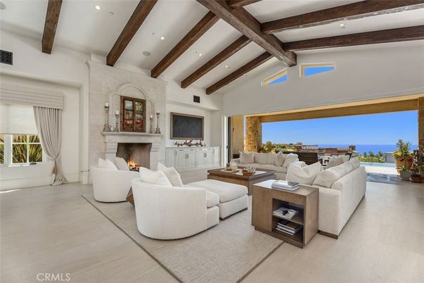 Fireplace, Interior, Living room, Recessed Lighting, Stone Walls, Water, Wooden Beams