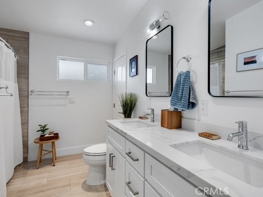 Bathroom, Dual Sink Vanities, Interior, Recessed Lighting, Wood Texture Flooring