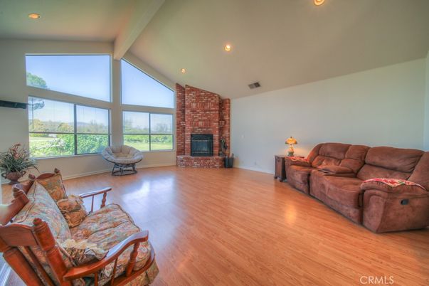 Fireplace, Interior, Living room, Recessed Lighting, Stone Walls, Wood Texture Flooring
