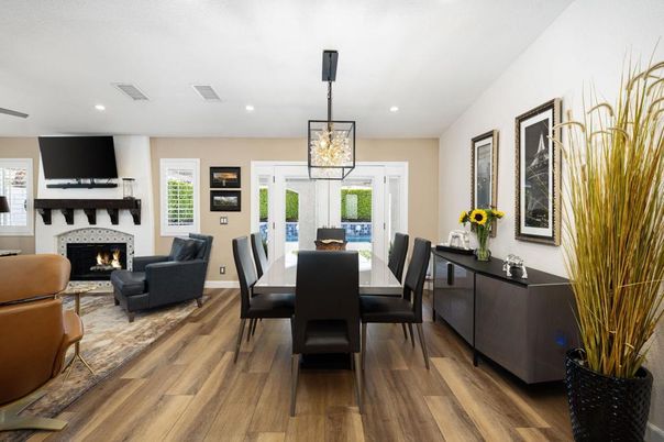 Dining room, Fireplace, Interior, Living room, Pendant Lights, Recessed Lighting, Wood Texture Flooring