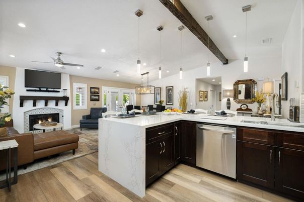 Fireplace, Interior, Kitchen, Living room, Pendant Lights, Recessed Lighting, Stainless Steel Appliances, Wood Texture Flooring