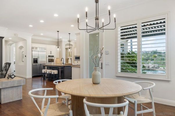Chandelier, Dining room, Interior, Kitchen, Pendant Lights, Recessed Lighting, Stainless Steel Appliances, Wood Texture Flooring