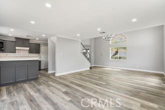 Chandelier, Empty room, Interior, Kitchen, Recessed Lighting, Stainless Steel Appliances, Wood Texture Flooring
