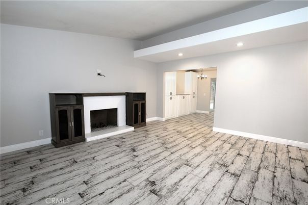 Empty room, Fireplace, Interior, Pendant Lights, Recessed Lighting, Wood Texture Flooring
