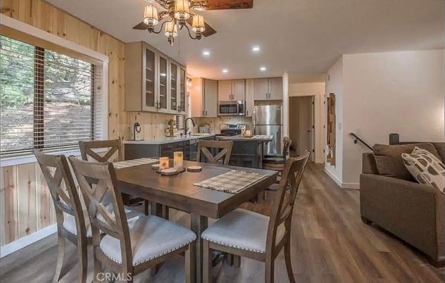 Chandelier, Dining room, Interior, Kitchen, Recessed Lighting, Stainless Steel Appliances, Wood Texture Flooring