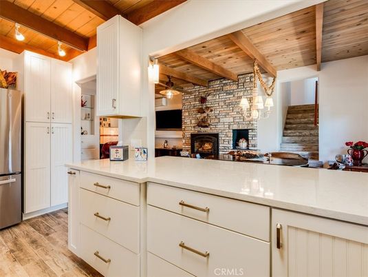 Fireplace, Interior, Kitchen, Pendant Lights, Stainless Steel Appliances, Stone Walls, Wooden Beams, Wooden Ceilings, Wood Texture Flooring