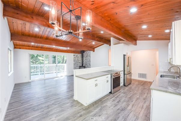 Fireplace, Interior, Kitchen, Recessed Lighting, Stainless Steel Appliances, Stone Walls, Wooden Beams, Wooden Ceilings, Wood Texture Flooring