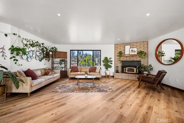 Fireplace, Interior, Living room, Recessed Lighting, Stone Walls, Wood Texture Flooring
