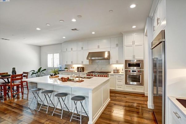 Dining room, Interior, Kitchen, Recessed Lighting, Stainless Steel Appliances, Wood Texture Flooring