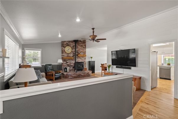 Fireplace, Interior, Living room, Recessed Lighting, Stone Walls, Wood Texture Flooring