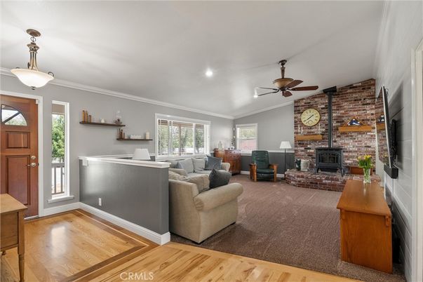 Fireplace, Interior, Living room, Pendant Lights, Recessed Lighting, Stone Walls, Wood Texture Flooring