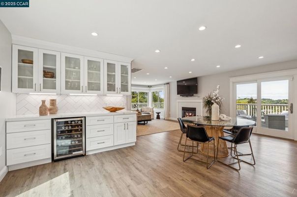 Dining room, Fireplace, Interior, Living room, Recessed Lighting, Wood Texture Flooring