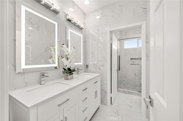 Bathroom, Dual Sink Vanities, Glass Shower, Interior, Marble, Marble Walls, Recessed Lighting