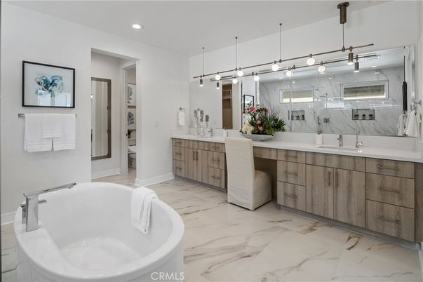 Bathroom, Dual Sink Vanities, Free Standing Baths, Interior, Marble, Marble Walls, Pendant Lights, Recessed Lighting