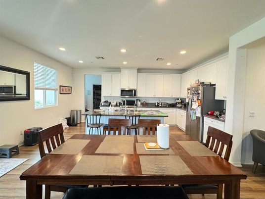 Dining room, Interior, Kitchen, Recessed Lighting, Stainless Steel Appliances, Wood Texture Flooring