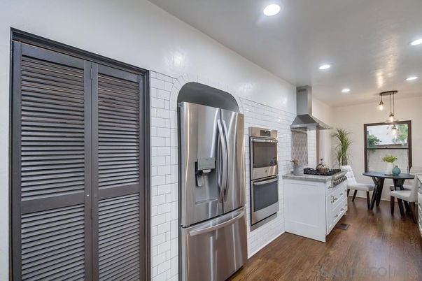 Dining room, Interior, Kitchen, Pendant Lights, Recessed Lighting, Stainless Steel Appliances, Wood Texture Flooring