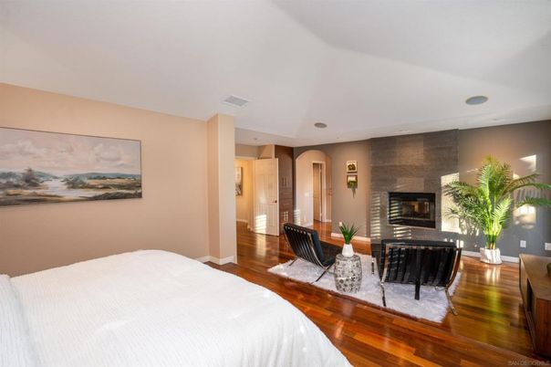 Bedroom, Fireplace, Interior, Recessed Lighting, Stone Walls, Wood Texture Flooring