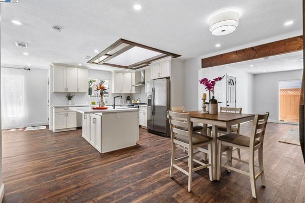 Dining room, Interior, Kitchen, Recessed Lighting, Stainless Steel Appliances, Wood Texture Flooring