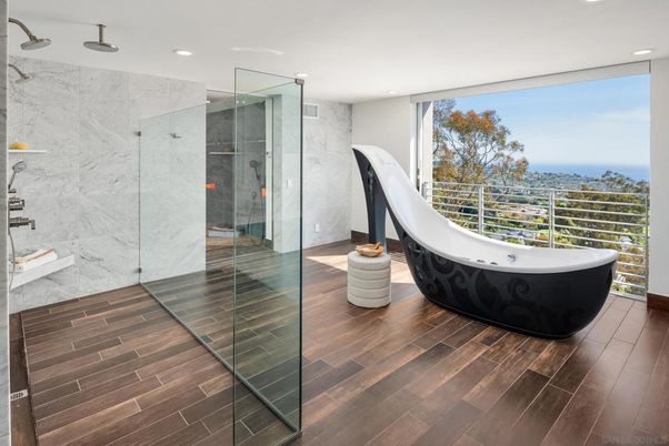 Bathroom, Free Standing Baths, Glass Shower, Interior, Marble Walls, Recessed Lighting, Water, Wood Texture Flooring