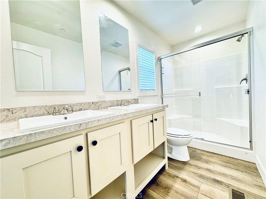Bathroom, Dual Sink Vanities, Glass Shower, Interior, Recessed Lighting, Wood Texture Flooring