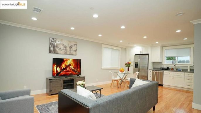 Dining room, Interior, Kitchen, Living room, Recessed Lighting, Stainless Steel Appliances, Wood Texture Flooring