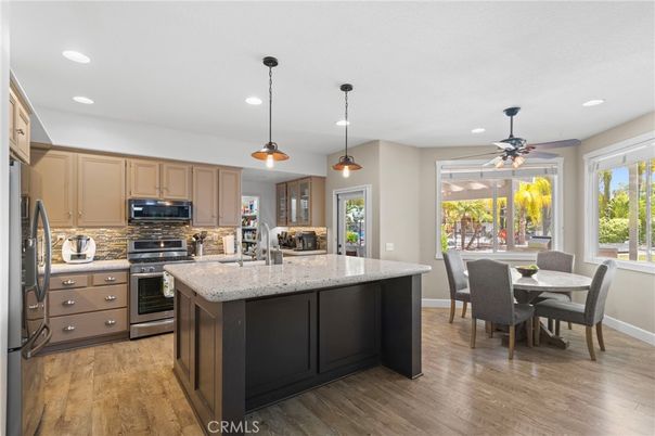 Dining room, Interior, Kitchen, Pendant Lights, Recessed Lighting, Stainless Steel Appliances, Wood Texture Flooring
