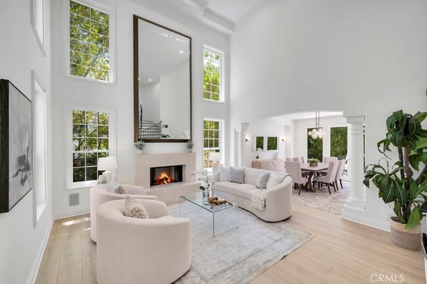 Chandelier, Dining room, Fireplace, Interior, Living room, Pendant Lights, Recessed Lighting, Wood Texture Flooring