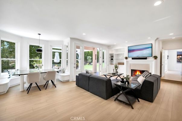 Dining room, Fireplace, Interior, Living room, Pendant Lights, Recessed Lighting, Wood Texture Flooring