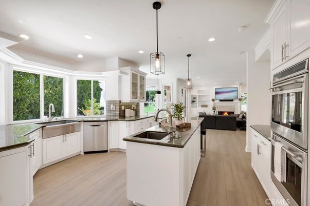 Fireplace, Interior, Kitchen, Living room, Pendant Lights, Recessed Lighting, Stainless Steel Appliances, Wood Texture Flooring
