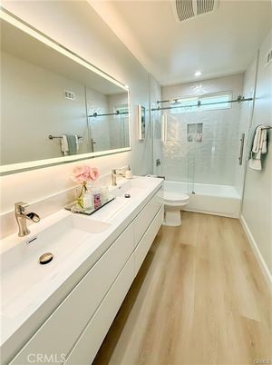 Bathroom, Dual Sink Vanities, Glass Shower, Interior, Recessed Lighting, Wood Texture Flooring
