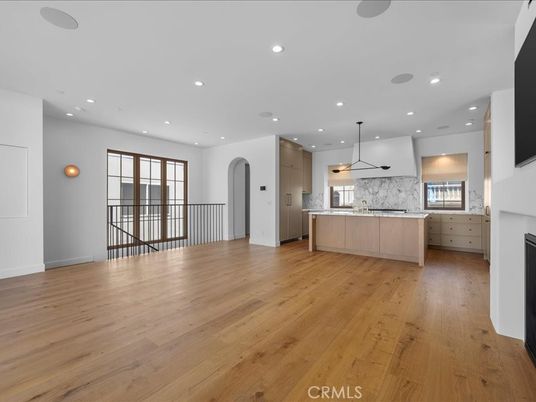 Interior, Kitchen, Marble Walls, Pendant Lights, Recessed Lighting, Stainless Steel Appliances, Wood Texture Flooring