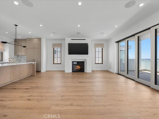 Empty room, Fireplace, Interior, Kitchen, Pendant Lights, Recessed Lighting, Wood Texture Flooring