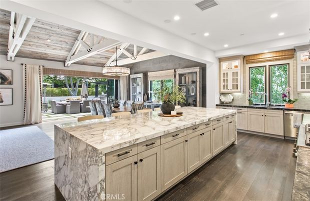 Chandelier, Dining room, Interior, Kitchen, Pendant Lights, Recessed Lighting, Stainless Steel Appliances, Wooden Ceilings, Wood Texture Flooring