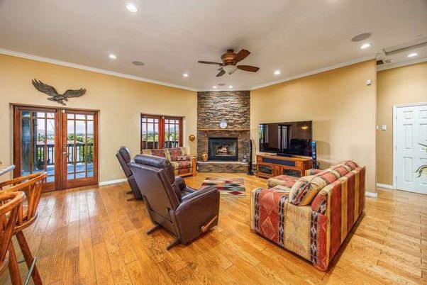 Fireplace, Interior, Living room, Recessed Lighting, Stone Walls, Wood Texture Flooring