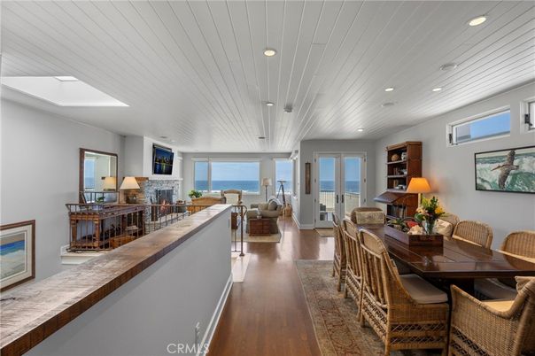 Dining room, Fireplace, Interior, Living room, Recessed Lighting, Water, Wood Texture Flooring