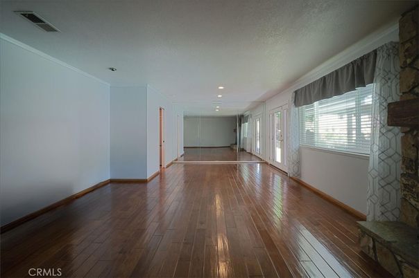 Empty room, Fireplace, Interior, Recessed Lighting, Stone Walls, Wood Texture Flooring