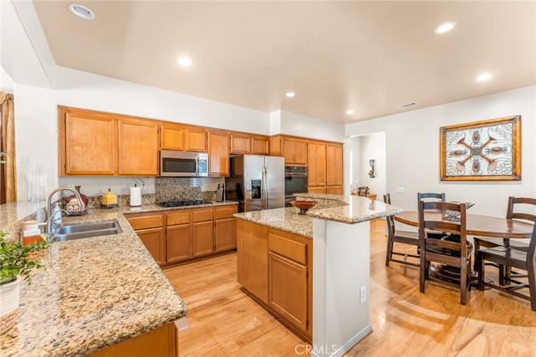 Dining room, Interior, Kitchen, Recessed Lighting, Stainless Steel Appliances, Wood Texture Flooring