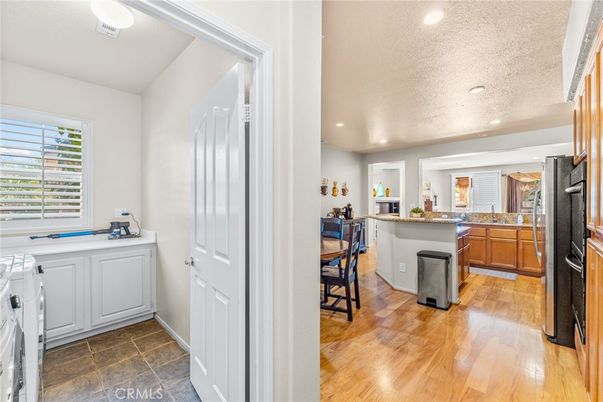 Interior, Kitchen, Recessed Lighting, Washer, Wood Texture Flooring