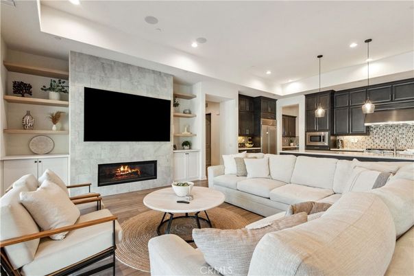Fireplace, Interior, Kitchen, Living room, Pendant Lights, Recessed Lighting, Stainless Steel Appliances, Wood Texture Flooring