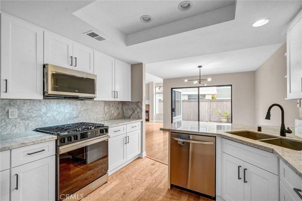 Interior, Kitchen, Pendant Lights, Recessed Lighting, Stainless Steel Appliances, Wood Texture Flooring